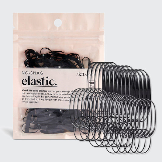 KITSCH Black No-Snag Elastics 100pc Set — hero product shot — black hair elastics fanned out beside the kraft pouch packaging — easy-glide coating removes without snagging
