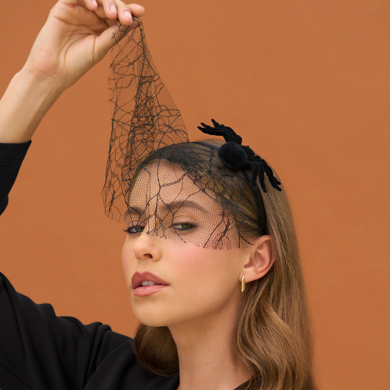 KITSCH Spiderweb Veil Headband — model styling spiderweb veil headband for a Halloween event — perfect for themed parties and costume looks