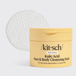 KITSCH Kojic Acid Face & Body Cleansing Pads — hero product shot on light gray background — yellow tub with single white pad displayed — BRIGHTENING | For dark spots, pigmentation, & uneven skin — Kojic Acid helps fade dark spots, reduce sun damage, and lighten acne scars — Turmeric Root Powder fights dullness and boosts antioxidants — Contains 50 pads