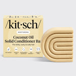 Kitsch Coconut Oil Solid Conditioner Bar with packaging displayed beside the bottle-free conditioner bar for moisturizing kinky, curly, and coily hair.