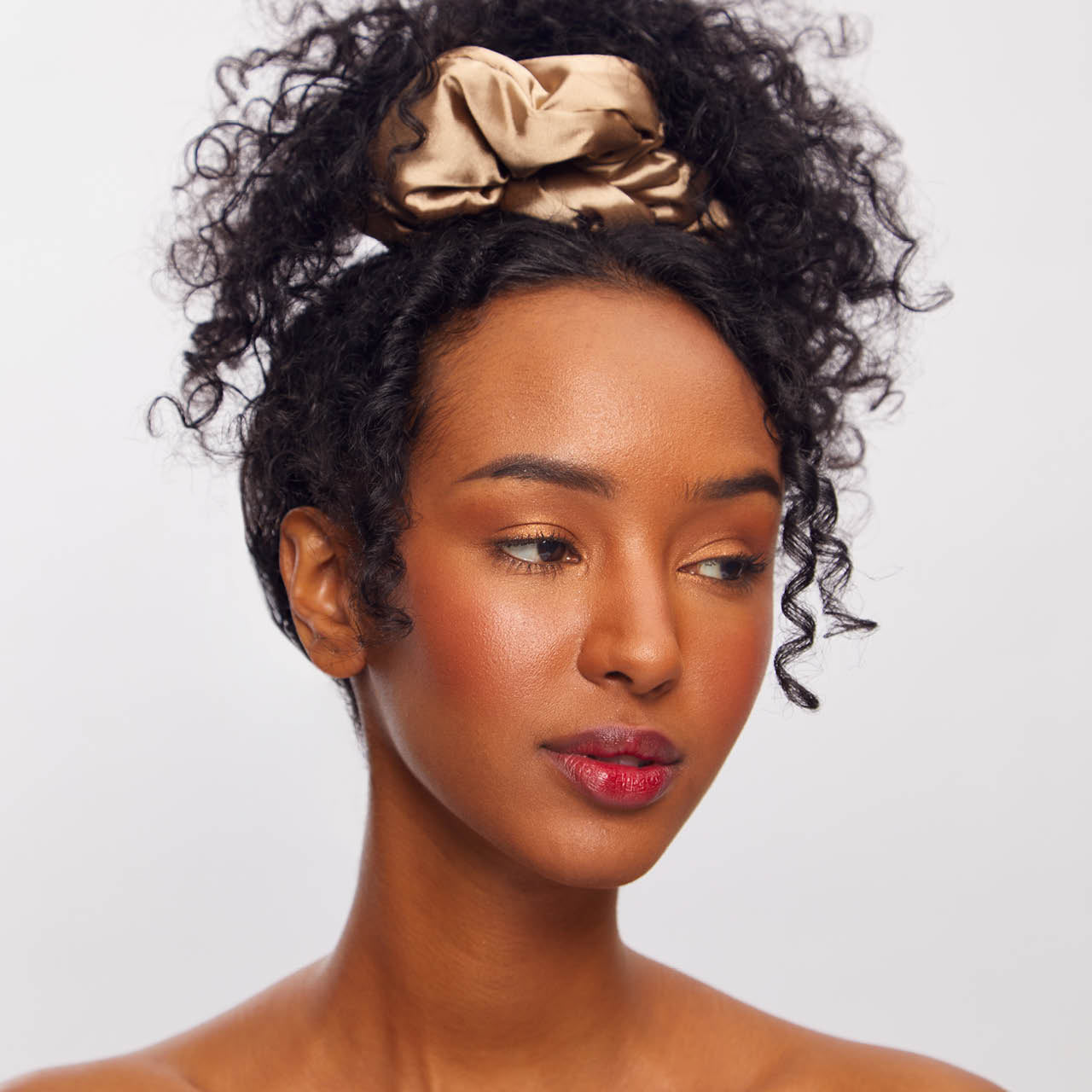 KITSCH Charcoal & Gold Satin Pillow Scrunchies — model wearing charcoal and gold satin pillow scrunchie — silky satin for snag-free daytime or overnight wear