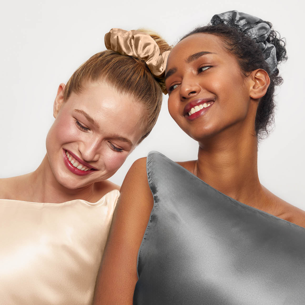 KITSCH Charcoal & Gold Satin Pillow Scrunchies — model with gold satin pillow scrunchie in hair — ultra-soft satin holds hair gently without damage or creasing