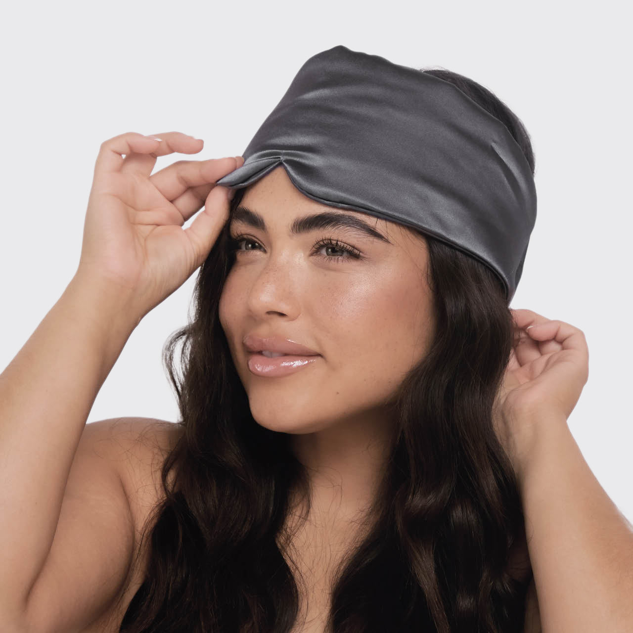 KITSCH Charcoal Satin Eye Mask — lifestyle shot — worn during sleep for light blockage