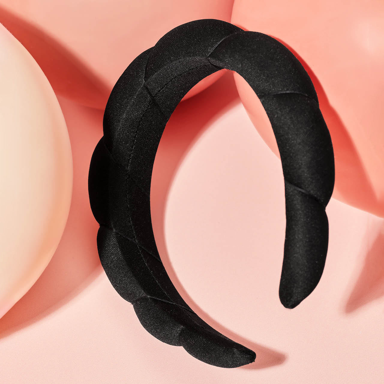 KITSCH Black Cloud Headband — creative product shot of black puffy cloud headband — made from recycled fabric for an eco-friendly, gentle-on-hair essential