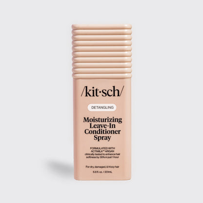 Kitsch Moisturizing Leave-In Conditioner Spray in blush packaging for dry, damaged, and frizzy hair, formulated with Actimilk™ Argan.