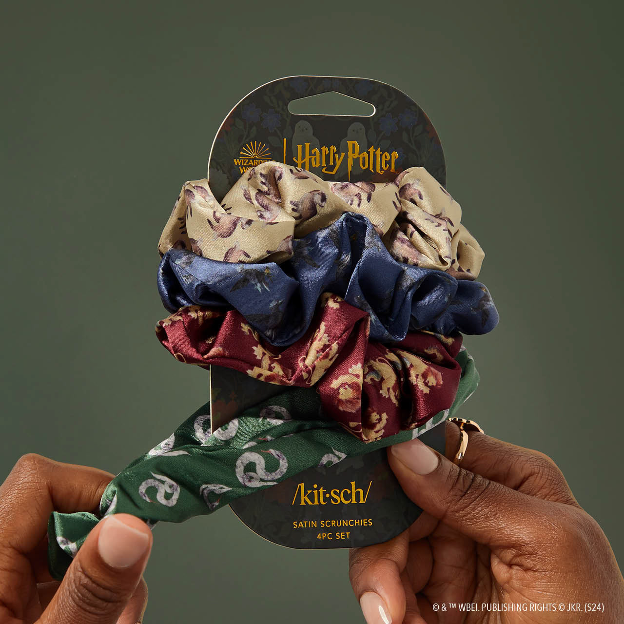 KITSCH Kitsch x Harry Potter Satin Scrunchies 4pc Set in All Houses — model styling hair with Harry Potter house scrunchie — silky satin is gentle on hair, no creasing or breakage