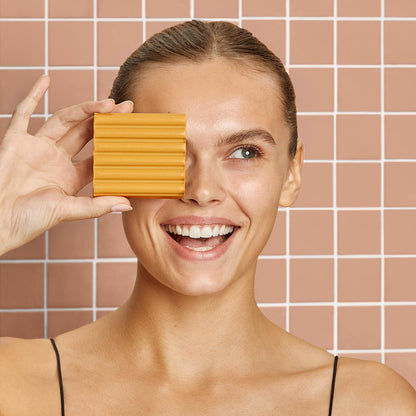KITSCH Kojic Acid Bar for Hyperpigmentation & Dark Spots — model lathering bar on skin — Sudsy lather renews your head-to-toe routine with skin-loving turmeric, hydrating hyaluronic acid, and nourishing shea butter — for brighter, more even-looking skin