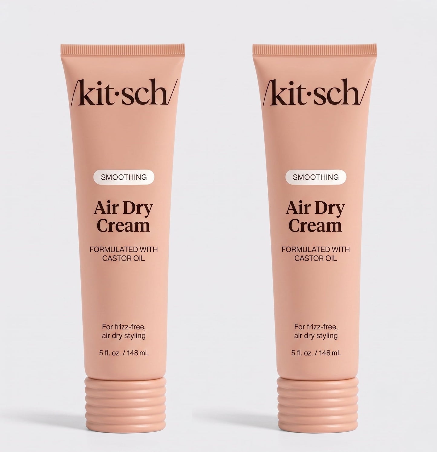 Two tubes of Kitsch Smoothing Air Dry Cream formulated with castor oil, 5 fl. oz. (148 mL), displayed side by side on a white background for frizz-free, air-dry styling.